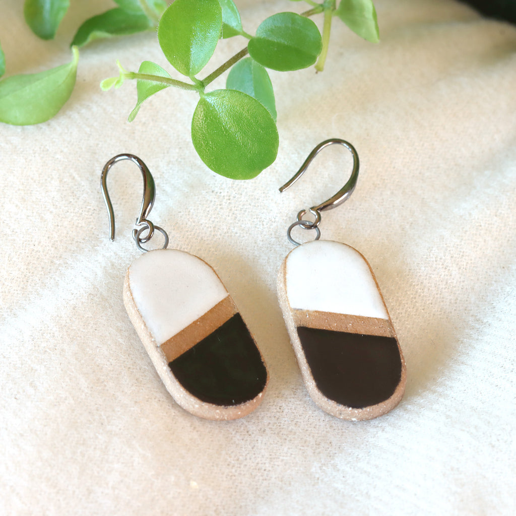 Handmade ceramic earrings in black and white