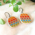 Handmade ceramic earrings with rainbow beehive pattern