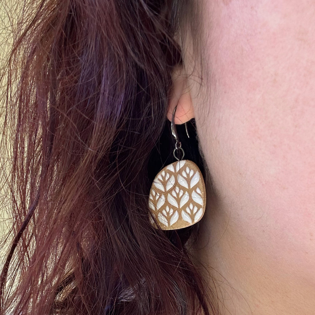 Handmade ceramic earrings with beautiful white blossom pattern