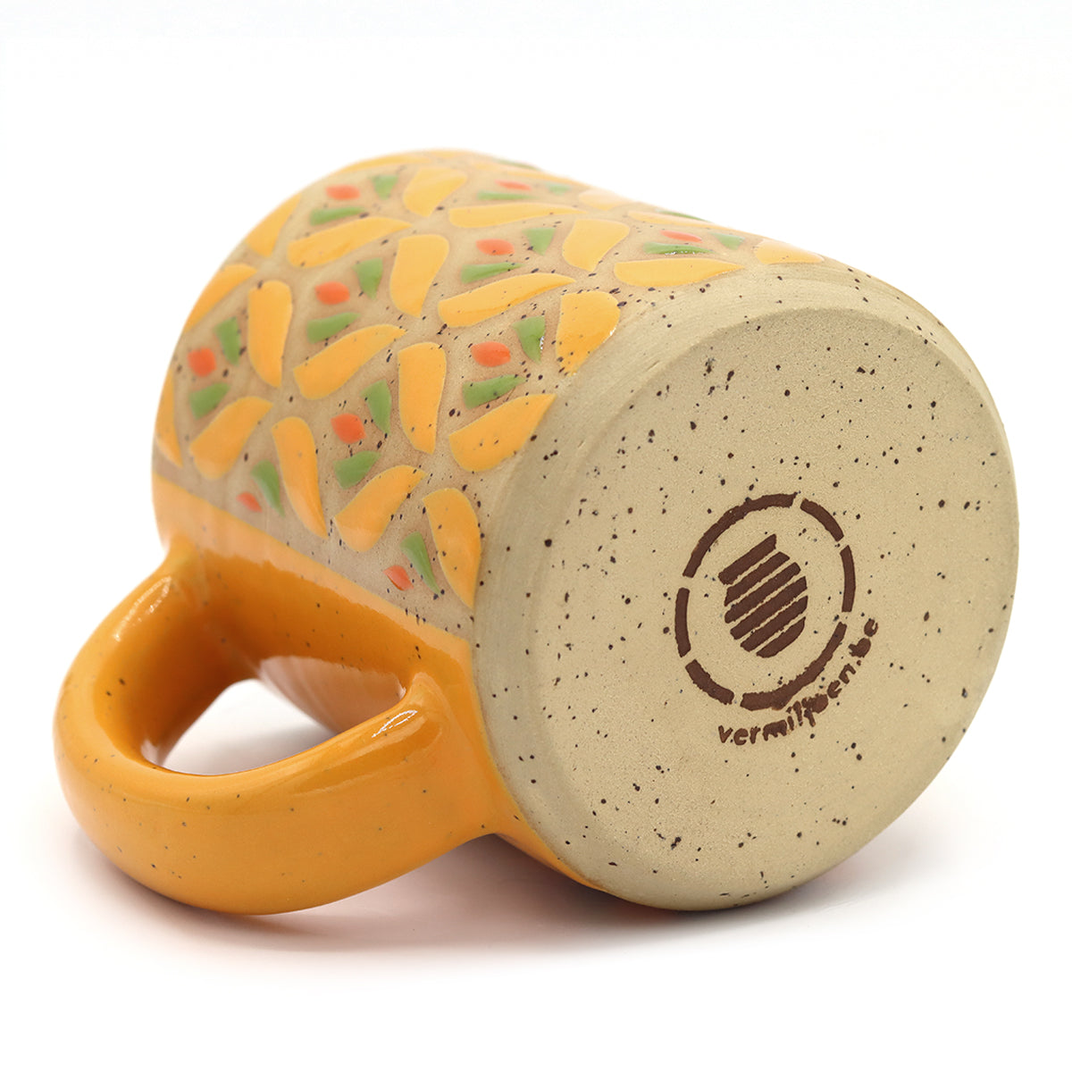 Handmade stoneware mug with yellow floral pattern