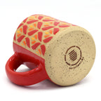 Handmade stoneware mug with vibrant floral pattern