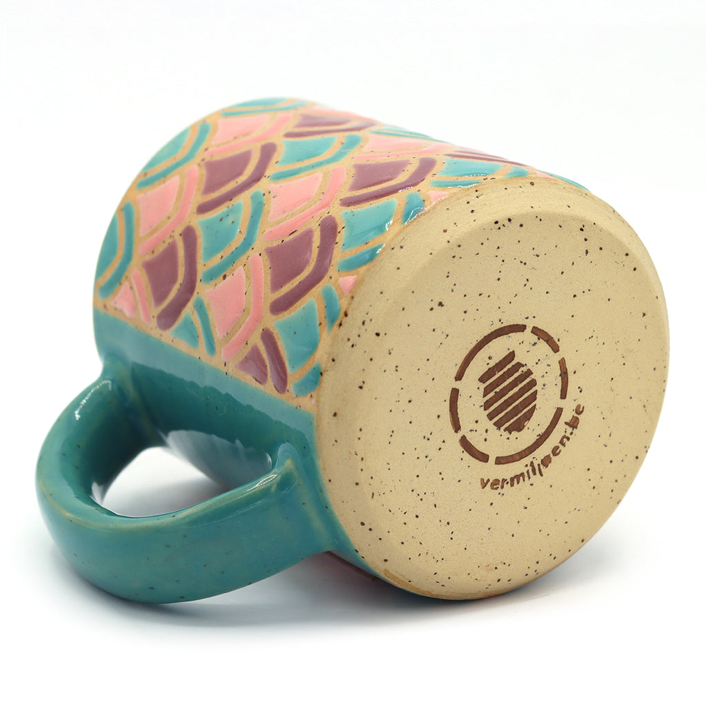 handmade ceramic mug with petal pattern in blue and purple