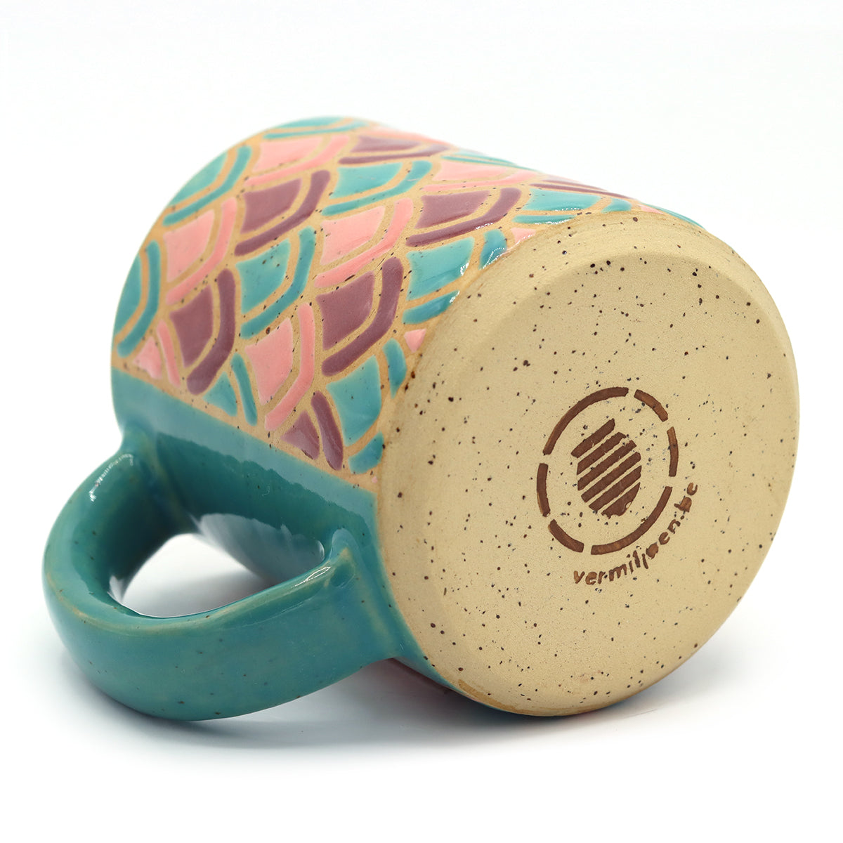 handmade ceramic mug with petal pattern in blue and purple