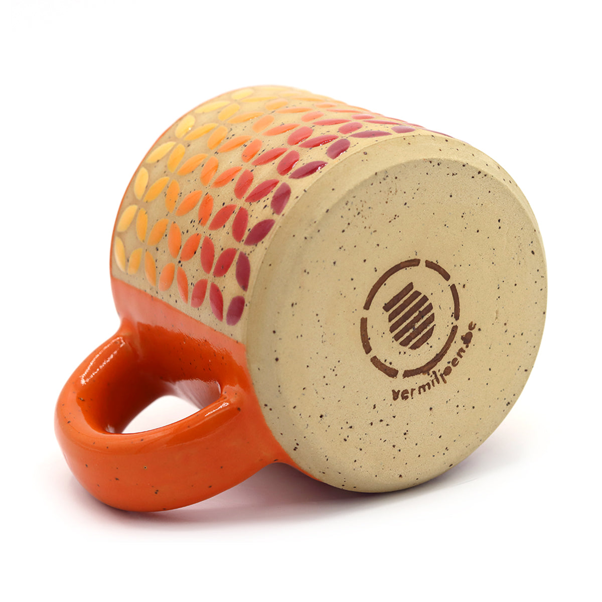 handmade ceramic mug with geometric pattern in vibrant colors