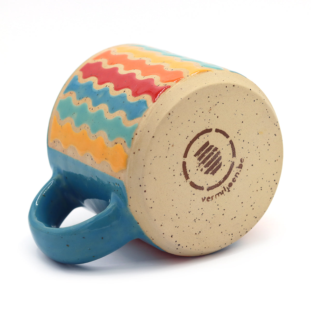 handmade ceramic mug with geometric pattern in vibrant colors