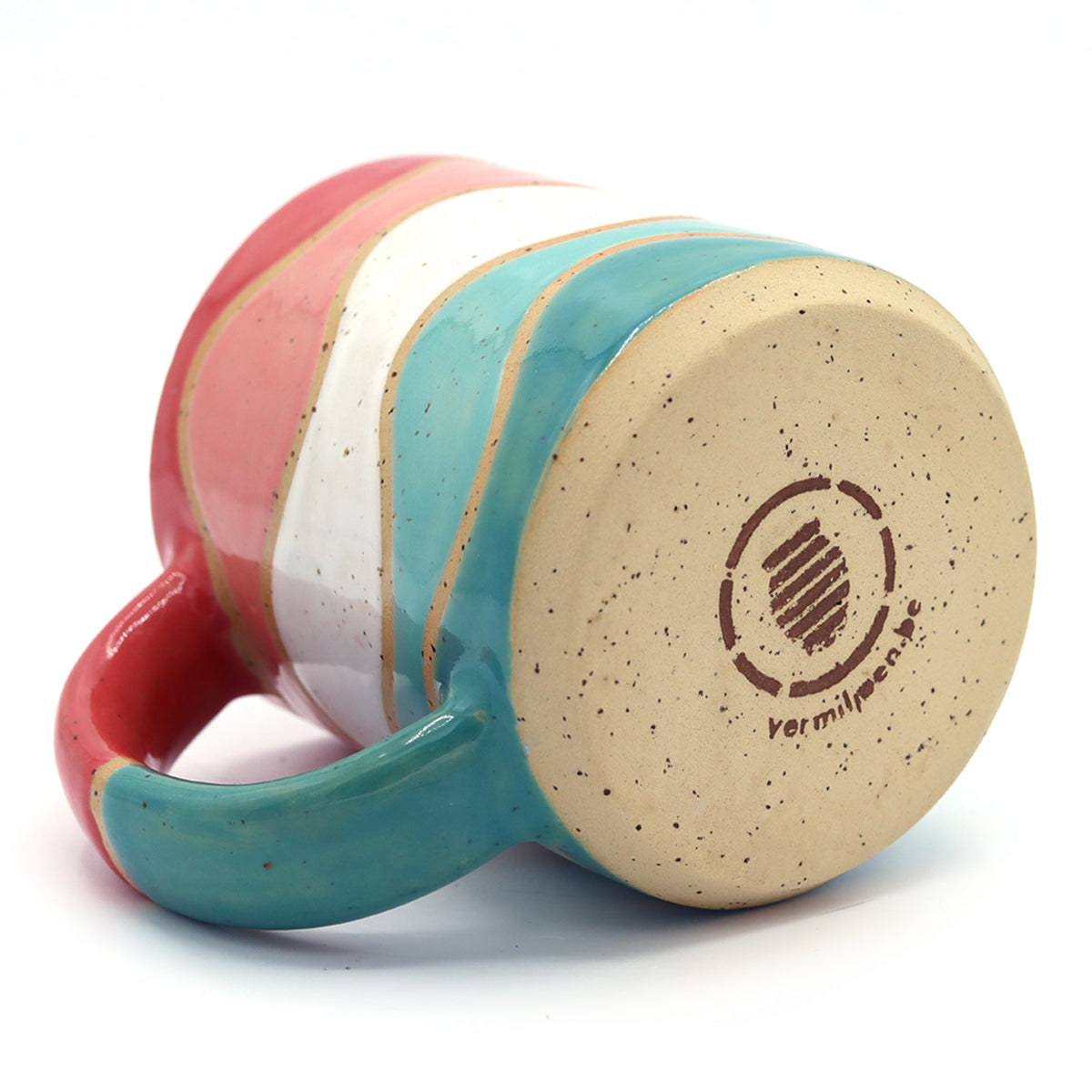 handmade ceramic mug with colourful pattern in vibrant colours