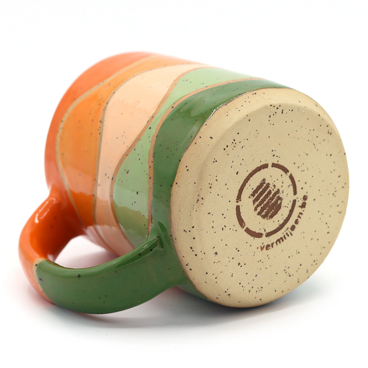 handmade ceramic mug from speckled clay with beautiful pattern in vibrant colours