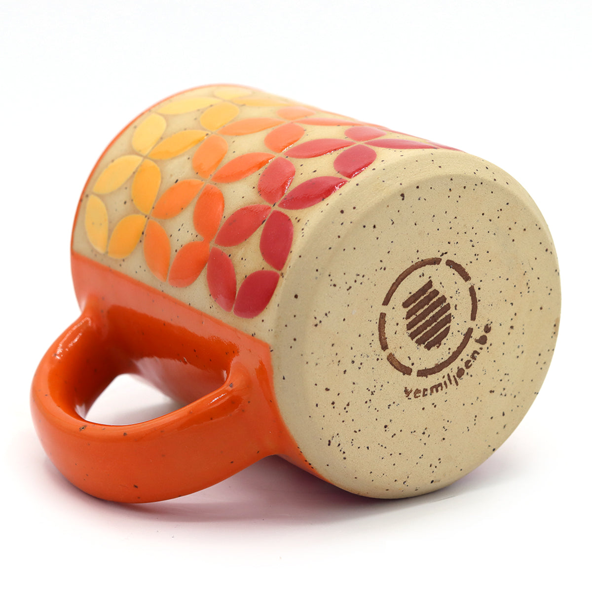 handmade speckled clay mug with colourful pattern