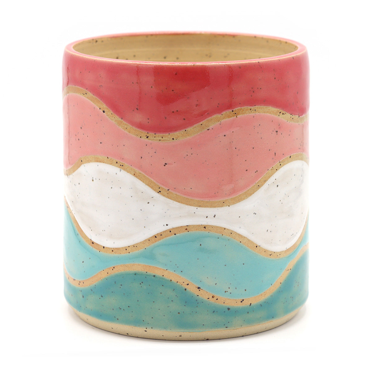 handgemaakte keramieken plantpot met golvend patroon in warme kleuren